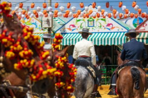 A horseback rider in front of a caseta at the Seville Feria de Abril.