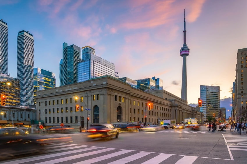 Downtown Toronto city skyline at twilight in Ontario, Canada, with glowing city lights — a must-see view during 3 days in Toronto.
